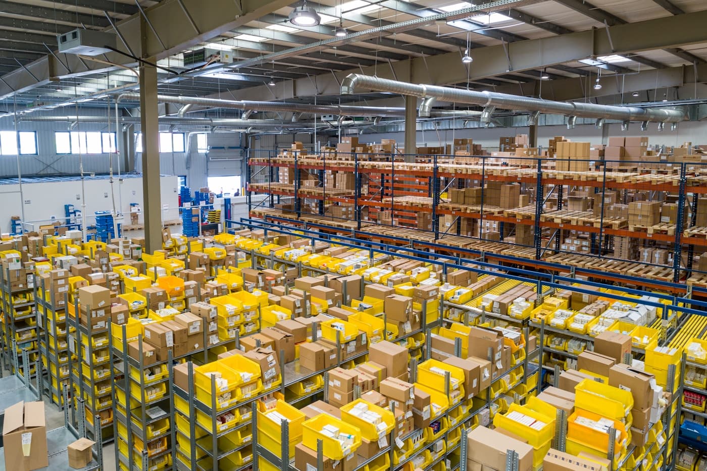 Building materials warehouse with pallet racking, inventory movement and loading dock operations, editorial context image
