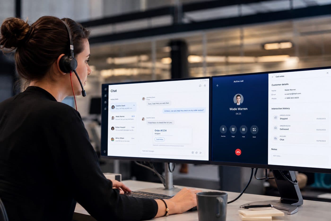 Support agent with headset at a multi-monitor service desk, editorial context image